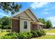 Brick and siding home exterior with manicured landscaping, an American flag, and a welcoming entrance at 400 N Main Gq St, Granite Quarry, NC 28146