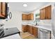 Well-lit kitchen featuring wood cabinets, stainless steel appliances, and modern countertops at 400 N Main Gq St, Granite Quarry, NC 28146