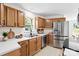 Charming kitchen featuring wooden cabinets, modern appliances, and a view from the window at 400 N Main Gq St, Granite Quarry, NC 28146