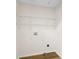 Laundry room featuring hardwood floors and built-in shelving at 400 N Main Gq St, Granite Quarry, NC 28146