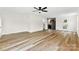 Spacious open living area with modern floors, connecting to a kitchen with stainless steel appliances at 400 N Main Gq St, Granite Quarry, NC 28146