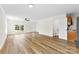 Bright and airy open-concept living area featuring modern flooring and large windows for plenty of natural light at 400 N Main Gq St, Granite Quarry, NC 28146