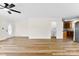 Inviting living area featuring modern flooring, and access to a kitchen with stainless steel refrigerator at 400 N Main Gq St, Granite Quarry, NC 28146