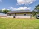 A charming home featuring a well-maintained lawn and a fenced backyard at 405 Jones Street St, Monroe, NC 28110