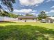 A charming home featuring a well-maintained lawn and a fenced backyard at 405 Jones Street St, Monroe, NC 28110