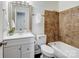 Stylish bathroom featuring tiled shower, vanity, and mirrored cabinet, combining functionality with design at 405 Jones Street St, Monroe, NC 28110