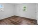 Bright bedroom featuring hardwood floors and a window letting in natural light at 405 Jones Street St, Monroe, NC 28110