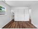 Bedroom featuring hardwood floors, a window, and access to closet spaces at 405 Jones Street St, Monroe, NC 28110
