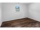 Bright bedroom featuring hardwood floors and a window letting in natural light at 405 Jones Street St, Monroe, NC 28110