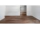 Hallway featuring hardwood floors and a view into another room at 405 Jones Street St, Monroe, NC 28110