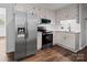 Contemporary kitchen equipped with stainless steel appliances, granite countertops, and bright cabinetry at 405 Jones Street St, Monroe, NC 28110