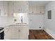 Functional kitchen space with modern sink, granite countertops, and ample storage cabinets at 405 Jones Street St, Monroe, NC 28110