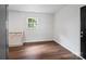 Open kitchen area with tiled backsplash, hardwood floors, and natural light, perfect for culinary creations at 405 Jones Street St, Monroe, NC 28110