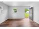 Bright and airy living room featuring hardwood floors and ample natural light from large windows at 405 Jones Street St, Monroe, NC 28110