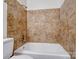 Close-up of tiled shower with modern fixtures, offering a clean and updated bathing experience at 405 Jones Street St, Monroe, NC 28110