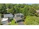 An aerial view of the beautiful home and garage surrounded by lush trees at 4208 Burning Tree Dr, Charlotte, NC 28277