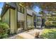 A patio area with sliding glass door and chairs outside this lovely homes backyard at 4208 Burning Tree Dr, Charlotte, NC 28277