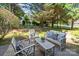 This backyard features stylish patio furniture and landscaping at 4208 Burning Tree Dr, Charlotte, NC 28277