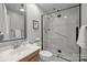 This bathroom features a glass shower with white tile, a nice vanity, and modern fixtures at 4208 Burning Tree Dr, Charlotte, NC 28277