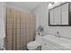 This bathroom features a shower with a stylish curtain and a nice sink and vanity at 4208 Burning Tree Dr, Charlotte, NC 28277