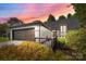 Charming home exterior with a two-car garage at 4208 Burning Tree Dr, Charlotte, NC 28277
