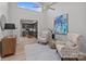 Bright living room with high ceilings, skylight, and view into the modern kitchen at 4208 Burning Tree Dr, Charlotte, NC 28277