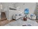 Cozy living room features a high ceiling, and a view into the dining room at 4208 Burning Tree Dr, Charlotte, NC 28277