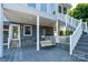 Backyard featuring a porch swing and stairs leading to a screened-in porch at 47209 Paradise Ln, Norwood, NC 28128