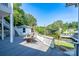 Tranquil backyard features a private waterfront view, complemented by a spacious deck with a hammock at 47209 Paradise Ln, Norwood, NC 28128