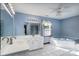 Large bathroom featuring a jacuzzi tub, large mirror, and natural light at 47209 Paradise Ln, Norwood, NC 28128