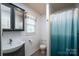 Charming bathroom with a vanity, mirror, toilet, and shower with curtain at 47209 Paradise Ln, Norwood, NC 28128