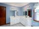Dual vanity bathroom with great lighting and storage space at 47209 Paradise Ln, Norwood, NC 28128