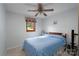 Cozy bedroom featuring a ceiling fan and comfortable furnishings at 47209 Paradise Ln, Norwood, NC 28128