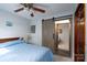 Bedroom features a barn door leading to another room at 47209 Paradise Ln, Norwood, NC 28128