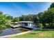 Stunning waterfront property featuring a private dock with a boat house and pier for outdoor enjoyment at 47209 Paradise Ln, Norwood, NC 28128