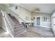 Welcoming foyer featuring beautiful flooring, a staircase, and ample natural light, creating a grand entrance at 47209 Paradise Ln, Norwood, NC 28128