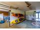 Spacious garage featuring kayak storage, bicycle, and ample room for tools and equipment at 47209 Paradise Ln, Norwood, NC 28128