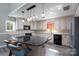 Modern kitchen with white cabinets, an island with barstool seating, and stainless steel appliances at 47209 Paradise Ln, Norwood, NC 28128