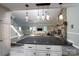 Open-concept living area with stone fireplace and access to kitchen island at 47209 Paradise Ln, Norwood, NC 28128