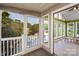 View from screened-in porch into sunroom showcasing lake views at 47209 Paradise Ln, Norwood, NC 28128