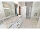 Bathroom features double vanity with granite counters, two sinks, tile floors, walk-in glass shower at 4940 Southview Dr, Hickory, NC 28602