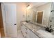 Bathroom features a double vanity, granite countertops, white cabinetry, and walk-in shower at 4940 Southview Dr, Hickory, NC 28602