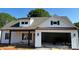 Charming two-story white home with a covered front porch, gray roof, and an attached garage under construction at 4940 Southview Dr, Hickory, NC 28602