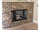 Rustic brick fireplace features a black metal screen for safety and adds warmth at 4940 Southview Dr, Hickory, NC 28602