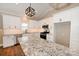 Modern kitchen features white cabinets, granite counters, stainless steel appliances, and subway tile backsplash at 4940 Southview Dr, Hickory, NC 28602