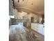 Modern kitchen featuring white cabinets, black hardware, granite countertops, subway tile backsplash, and a spacious island at 4940 Southview Dr, Hickory, NC 28602