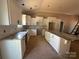Bright kitchen with white cabinets, granite countertops, a kitchen island, and stainless steel appliances, under construction at 4940 Southview Dr, Hickory, NC 28602