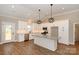 Spacious kitchen with white cabinets, granite counters, stainless appliances, and large island at 4940 Southview Dr, Hickory, NC 28602