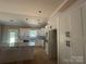 Modern kitchen with white cabinetry, granite countertops, subway tile backsplash, and a spacious island for cooking and dining at 4940 Southview Dr, Hickory, NC 28602