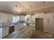 Spacious kitchen with white cabinets, subway tile backsplash, and a large island with granite countertops at 4940 Southview Dr, Hickory, NC 28602